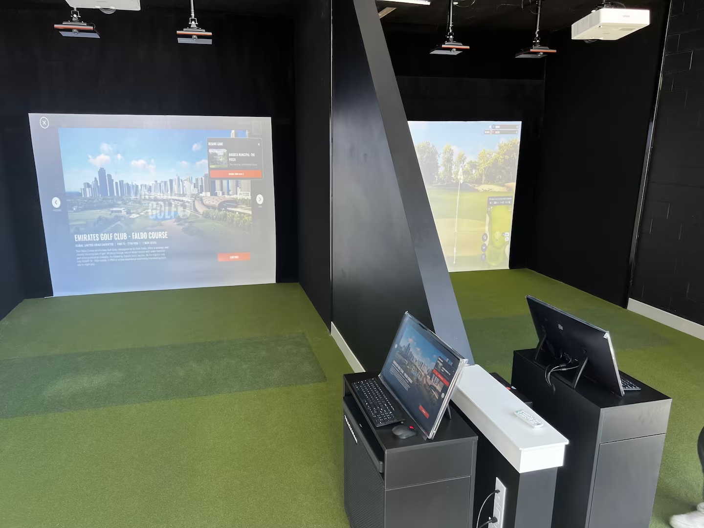 One of two TrackMan golf simulator bays
